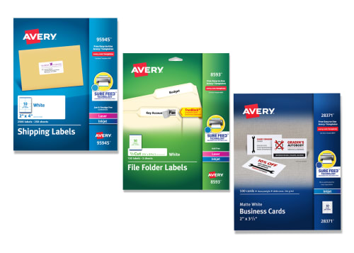 Three packages of Avery Sure Feed Card products, including postcards, tent cards and business cards, laying diagonally next to each other